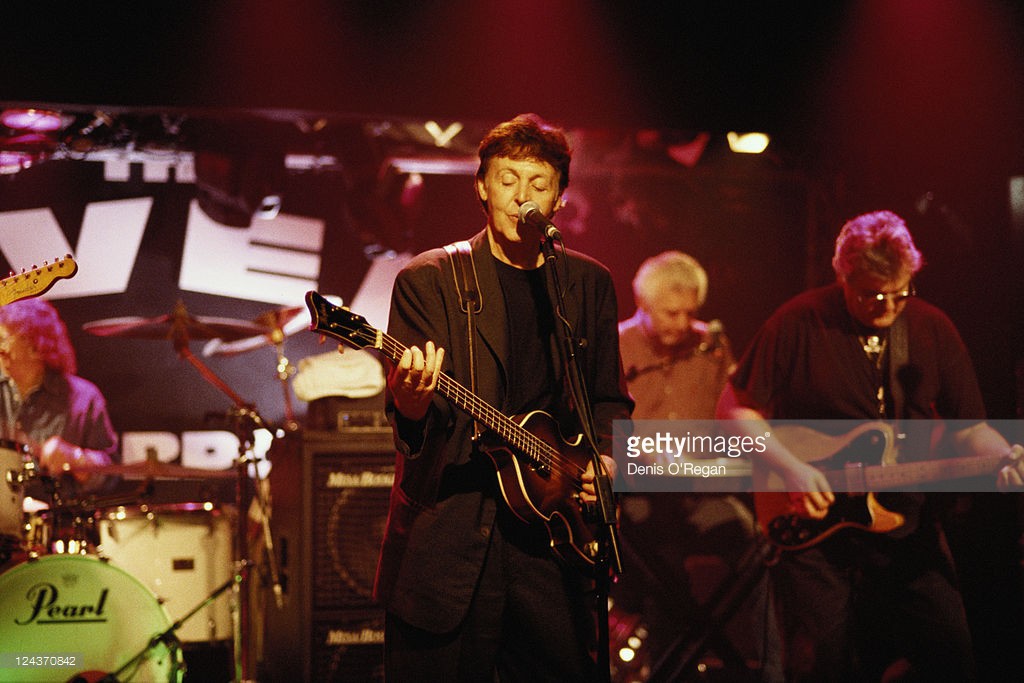 Paul McCartney and his all-star band rehearsing for their concert at the Cavern Club, Liverpool, 14th December 1999. From centre: McCartney, Pete Wingfield and Mick Green.