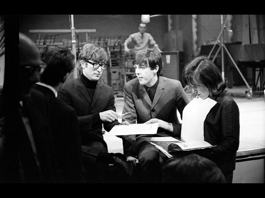 John Lennon and Paul McCartney talk with production staff of the radio pop music programme 'Saturday Club' in December 1963. The inspiration for their early work came from the sounds of their youth: music hall, blues, skiffle, soul and rock 'n' roll.