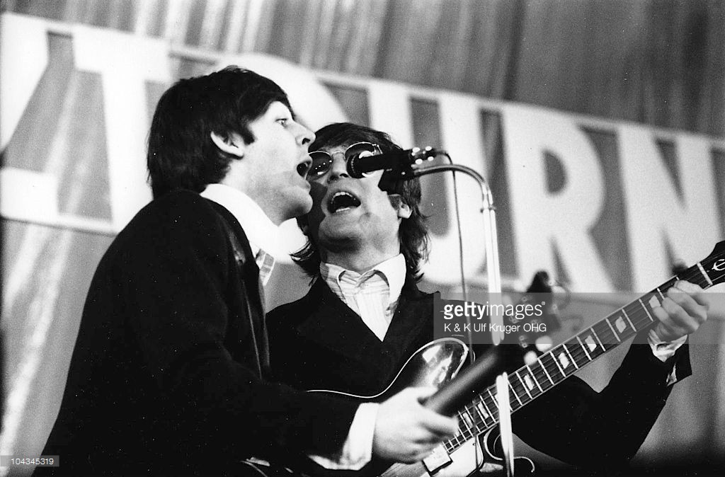 Paul McCartney and John Lennon of the Beatles perform on stage at Ernst Merck Halle on their final German tour (the Bravo-Beatles-Blitztournee) on 26th June 1966 in Hamburg, Germany - Credits : K & K Ulf Kruger OHG