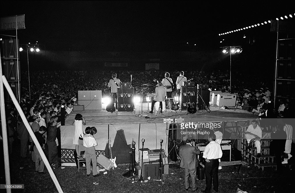 The Beatles on stage on June 28, 1965 in Rome, Italy. Credits: Reporters Associés
