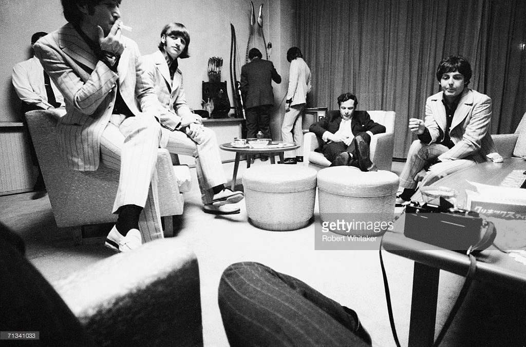 John Lennon, Ringo Starr, Beatles road manager Neil Aspinall, George Harrison, Beatles manager Brian Epstein and Paul McCartney backstage at Tokyo's Budokan Hall, Japan, July 2nd 1966.