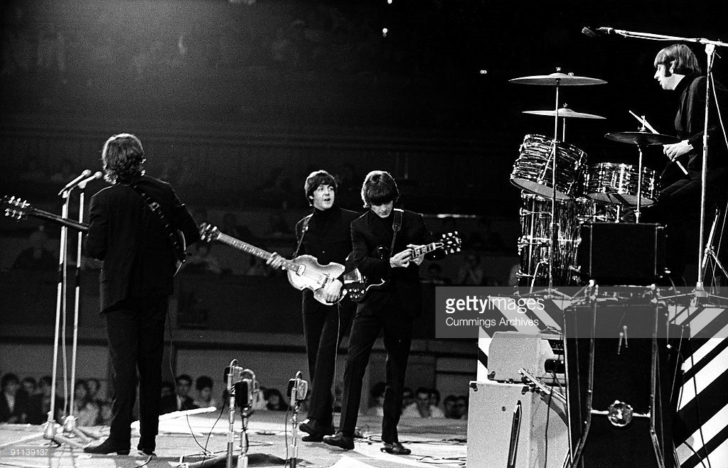 Photo of BEATLES, L-R. John Lennon, Paul McCartney, George Harrison (with Gibson SG guitar), Ringo Starr performing live onstage at NME Poll Winners concert - Credits: Cummings Archives