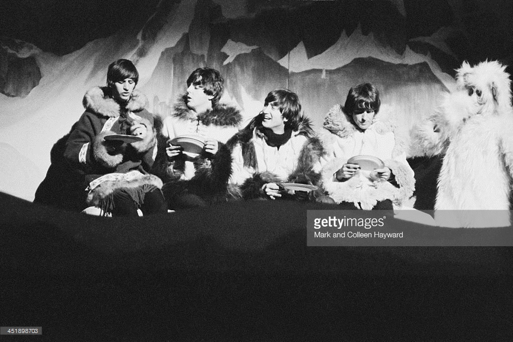 The Beatles perform a sketch dressed in 'Eskimo' costumes at 'Another Beatles Christmas Show' at Hammersmith Odeon in London on 24th December 1964. Left to right: Ringo Starr, Paul McCartney, John Lennon (1940-1980) and George Harrison (1943-2001). Crédits: Mark And Colleen Hayward